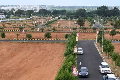 A serene, green open plot at the Green Meadows venture in Aushapur.